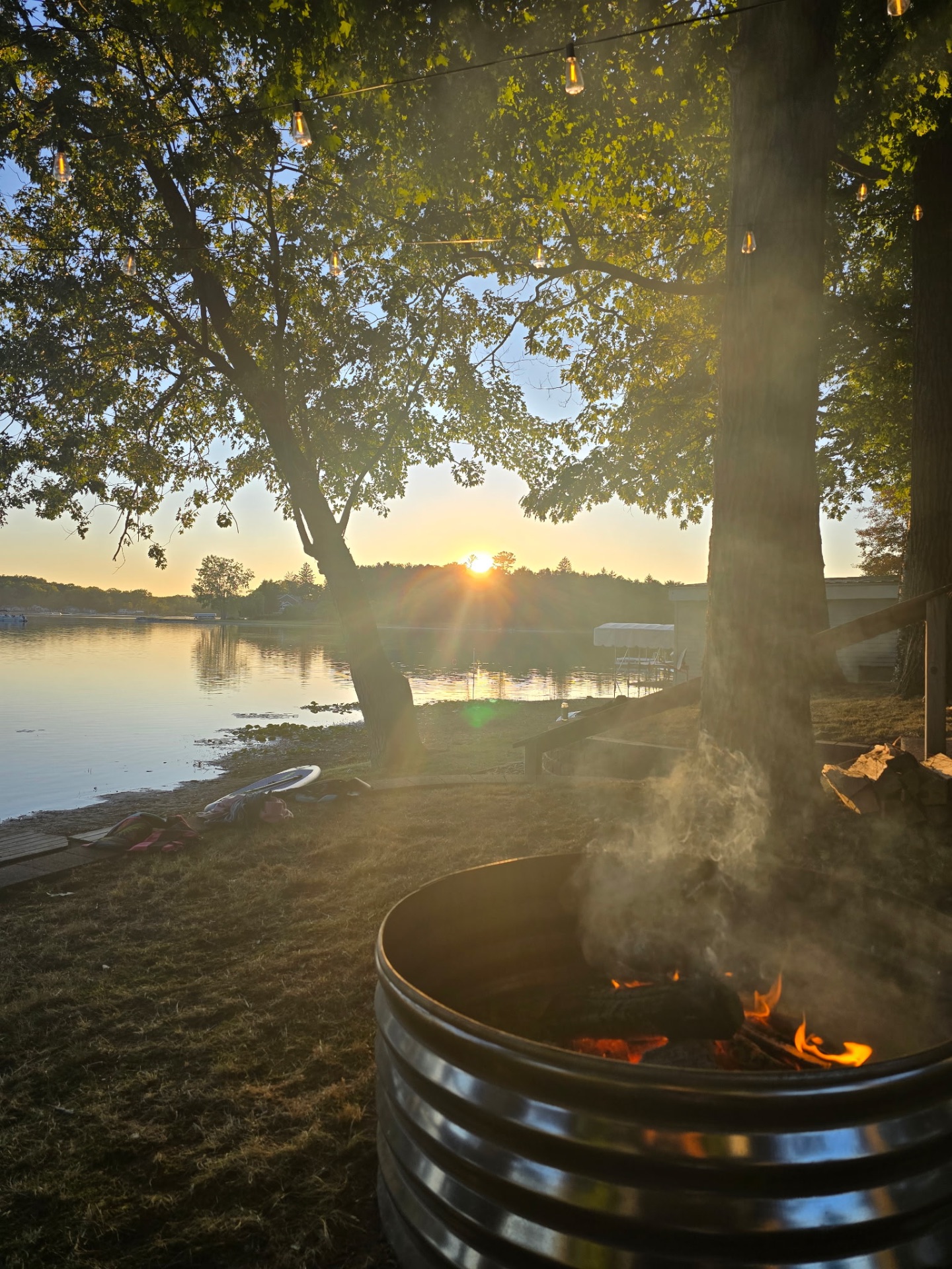 SandBaar cottage glowing at sunset by the lake